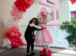 Hundreds of fans welcome Hello Kitty and her new cafe